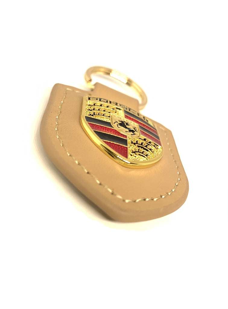Porsche Porte-clés original en cuir jaune avec blason métallique dans une  boîte de présentation argentée : : Mode