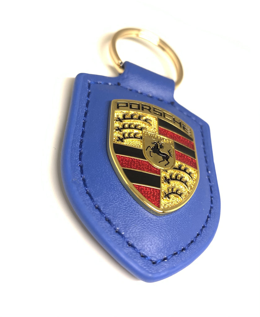 Porte clé bleu neuf Porsche avec une jolie boîte